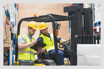 forklift instructor reviewing operator assessment